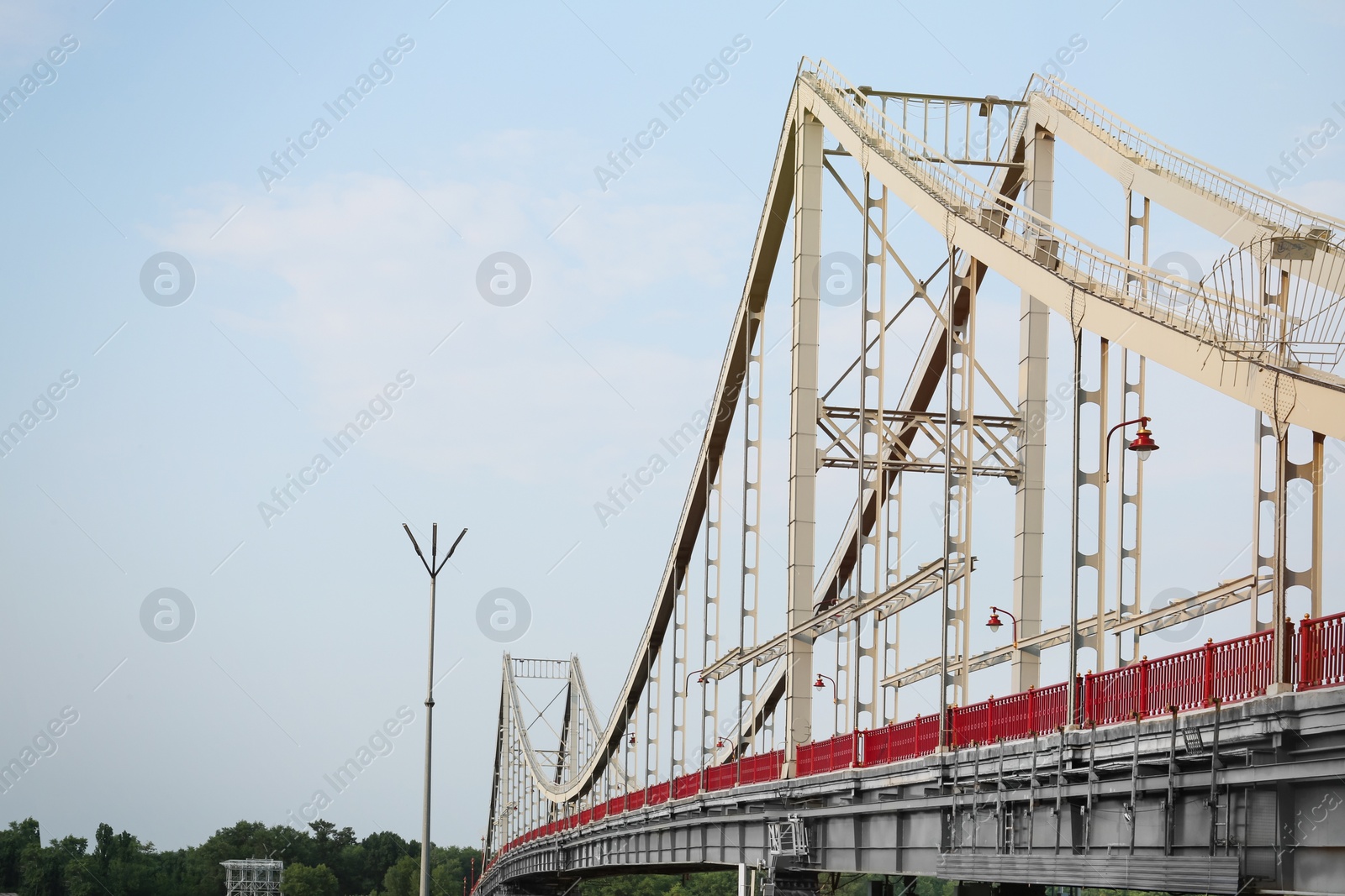 Photo of KYIV, UKRAINE - AUGUST 11, 2022: Beautiful view of modern pedestrian Park bridge over Dnipro river