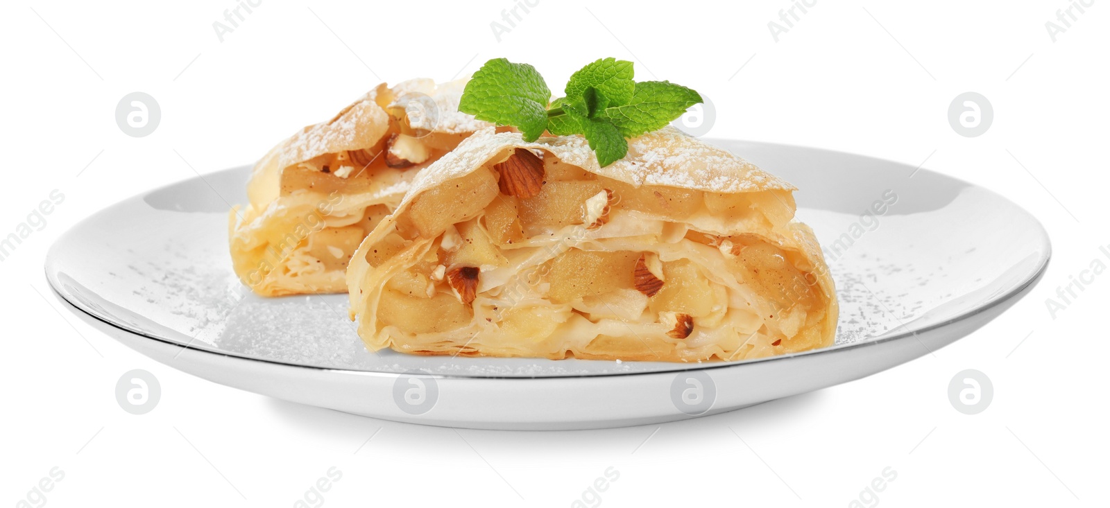 Photo of Pieces of delicious apple strudel with almonds, powdered sugar and mint on white background