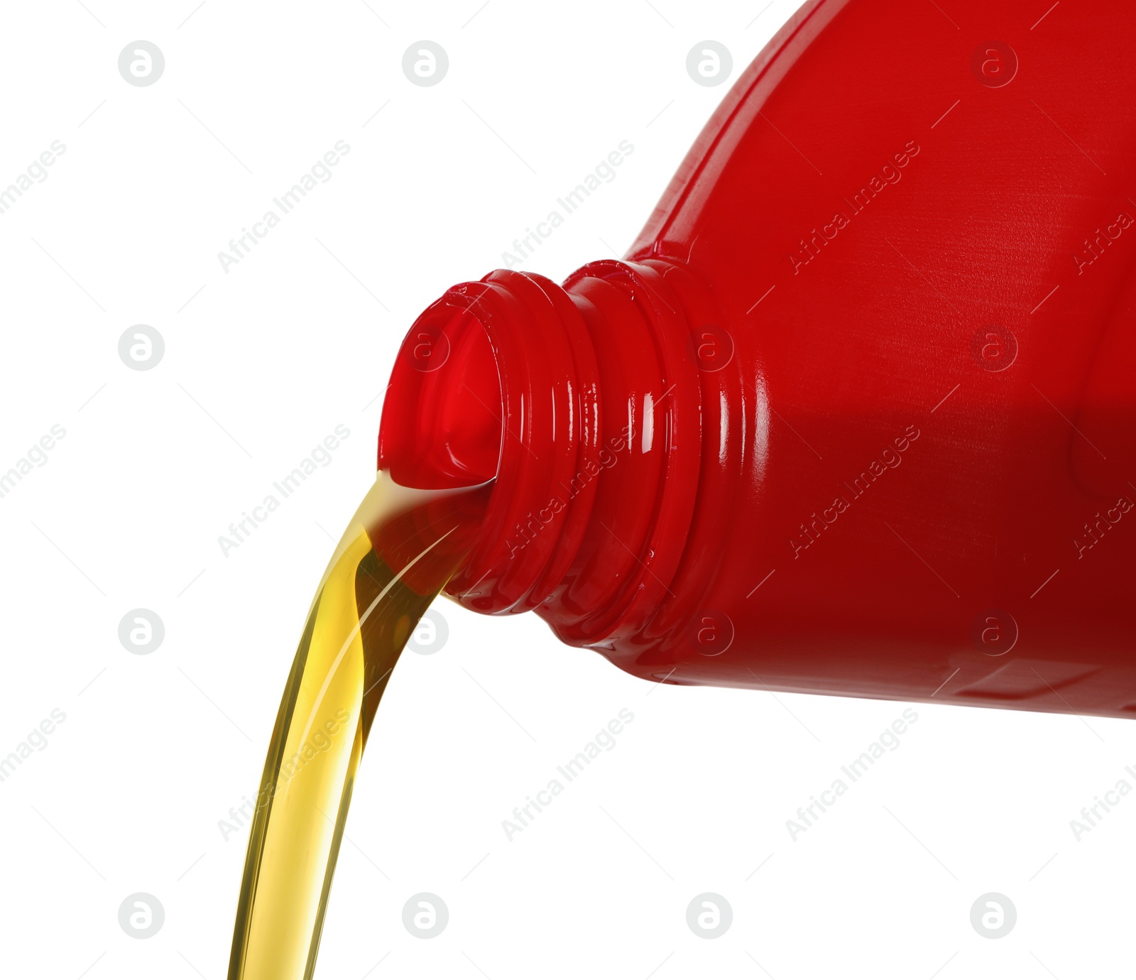 Photo of Pouring motor oil from red container isolated on white