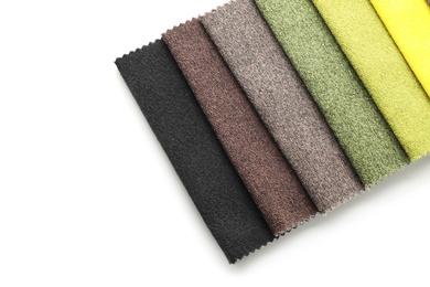 Photo of Fabric samples of different colors for interior design on white background