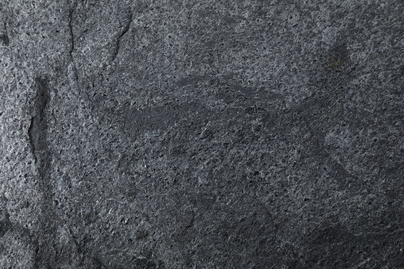 Image of Texture of dark grey stone surface as background, closeup