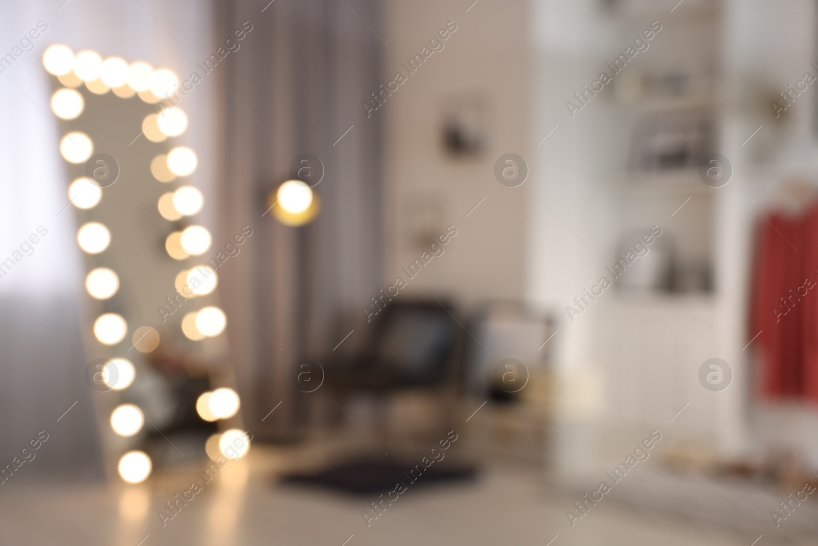Photo of Blurred view of makeup room with stylish mirror