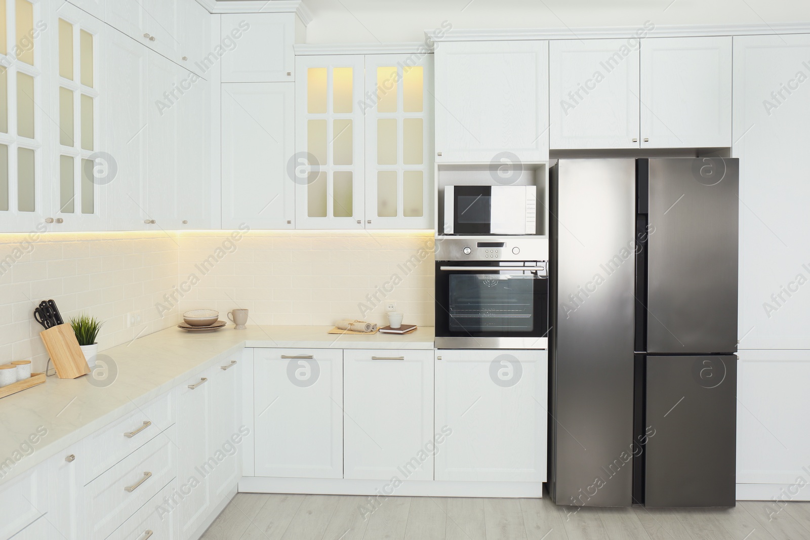 Photo of Beautiful kitchen interior with new stylish furniture