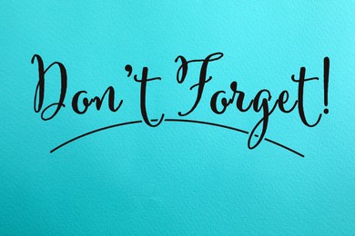 Image of Phrase Don't forget written on blue paper