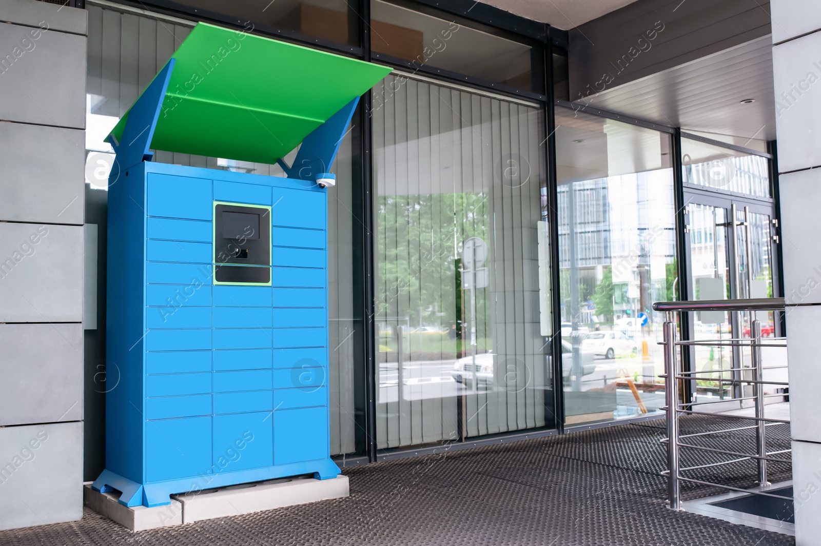 Photo of Parcel locker with many postal boxes near building outdoors