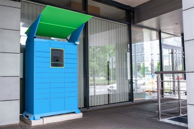 Photo of Parcel locker with many postal boxes near building outdoors