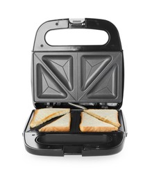 Photo of Modern sandwich maker with bread slices on white background