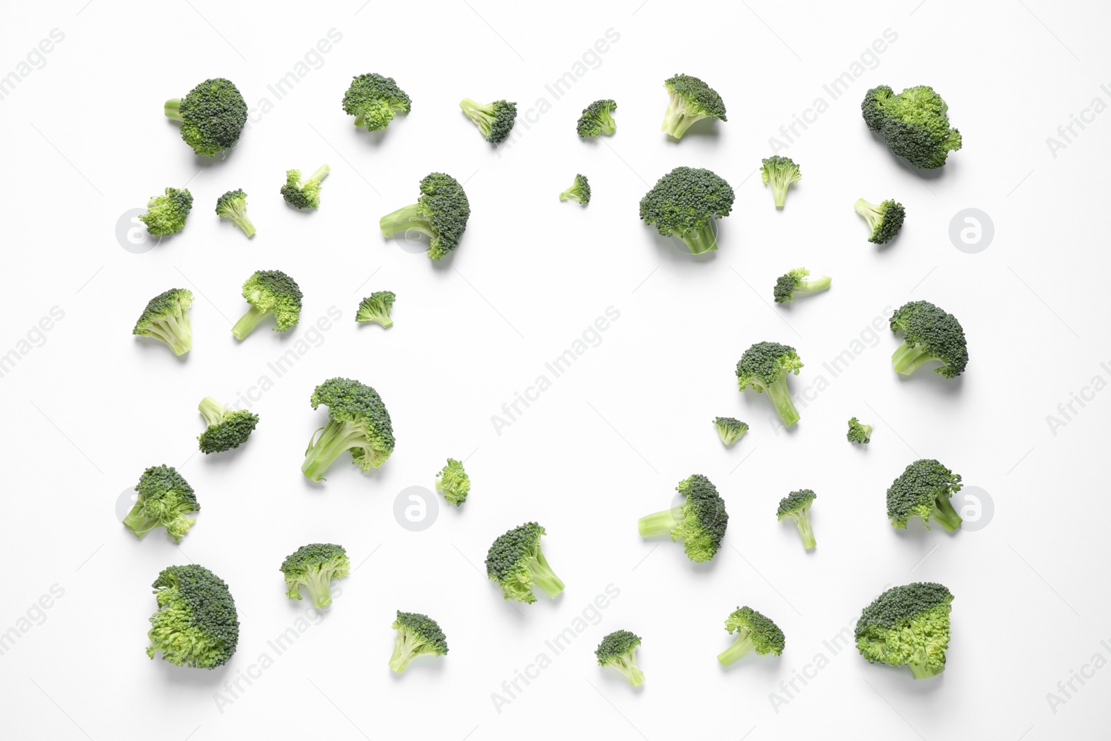 Photo of Fresh tasty broccoli on white background, top view