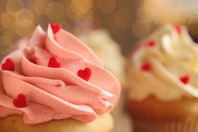 Tasty sweet cupcake on blurred background, closeup view with space for text. Happy Valentine's Day