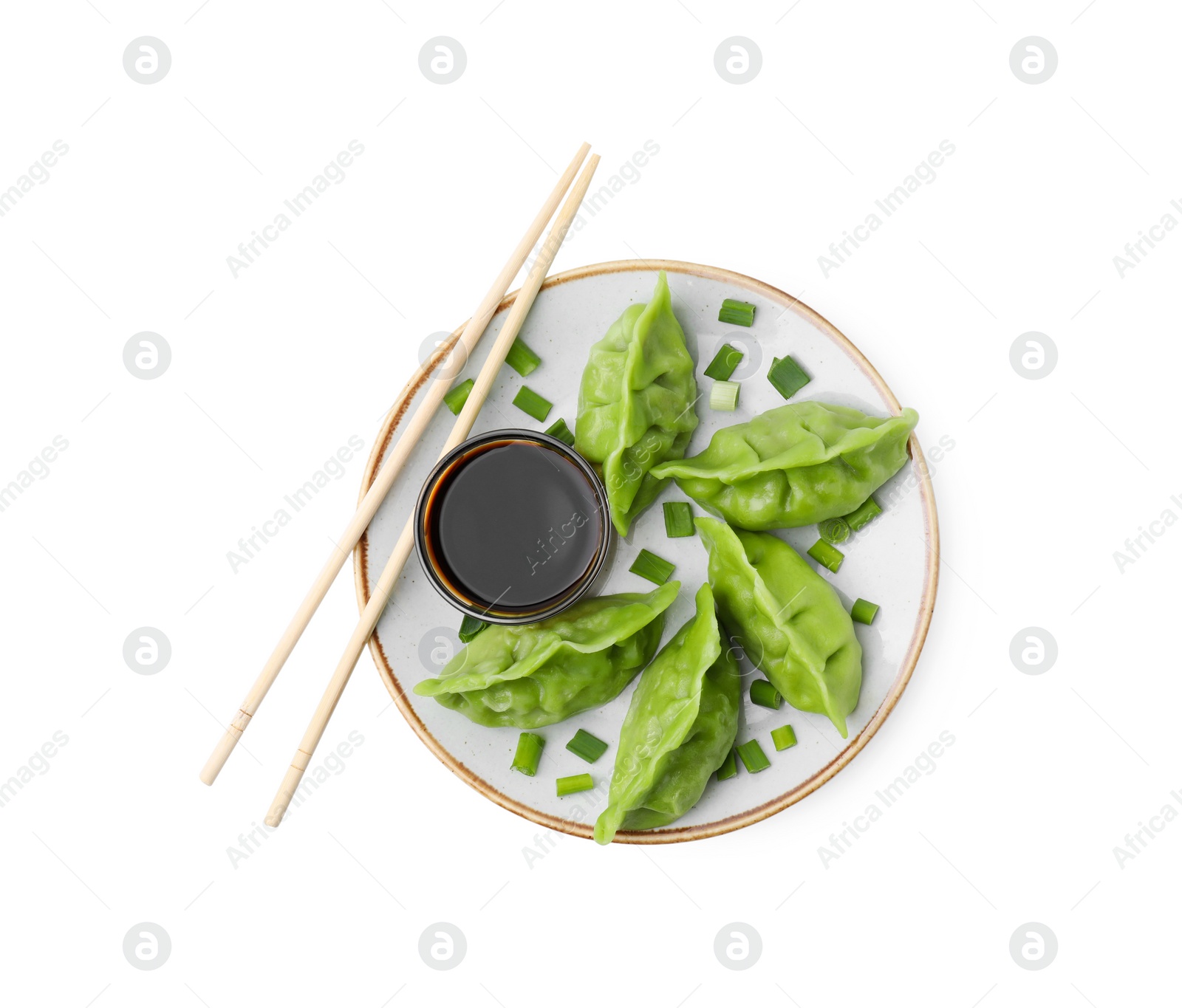 Photo of Delicious green dumplings (gyozas) and soy sauce isolated on white, top view