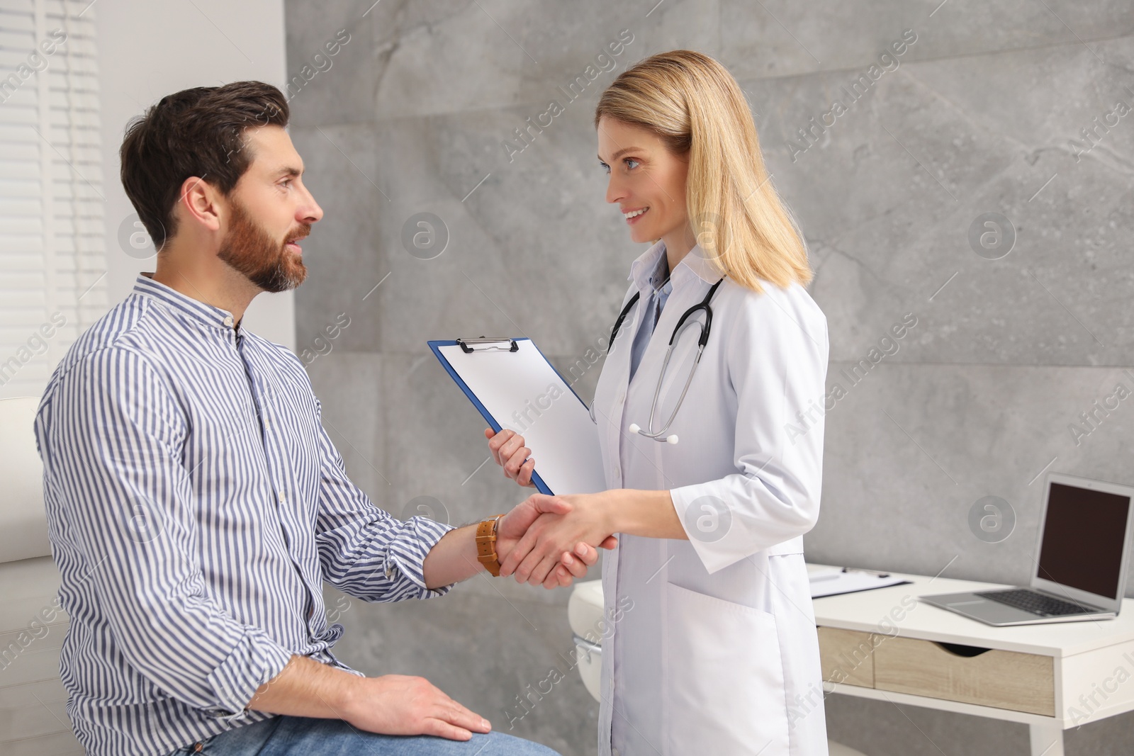 Photo of Patient having appointment with doctor in clinic