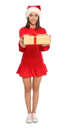 Young happy woman with Santa hat and gift box on white background. Christmas celebration