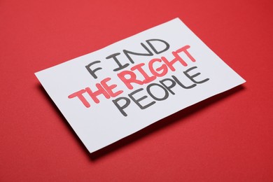 Photo of Card with motivational phrase Find The Right People on red background