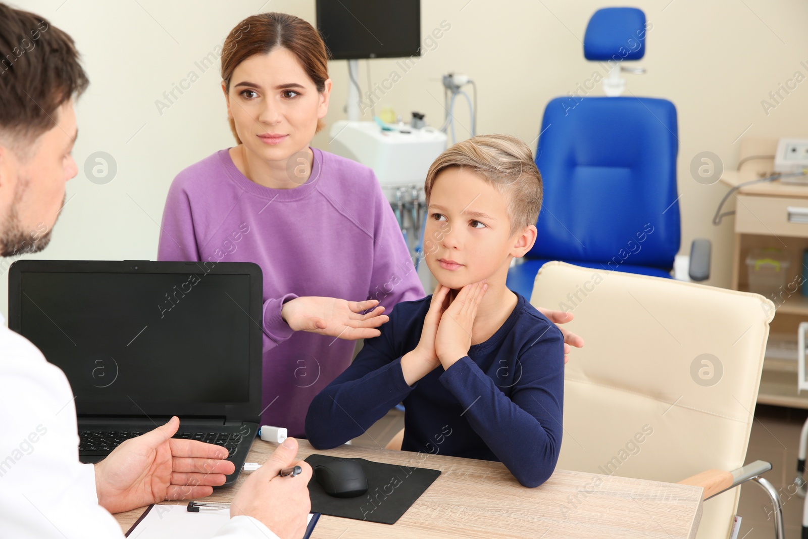 Photo of Woman with her child visiting doctor in hospital. Space for text