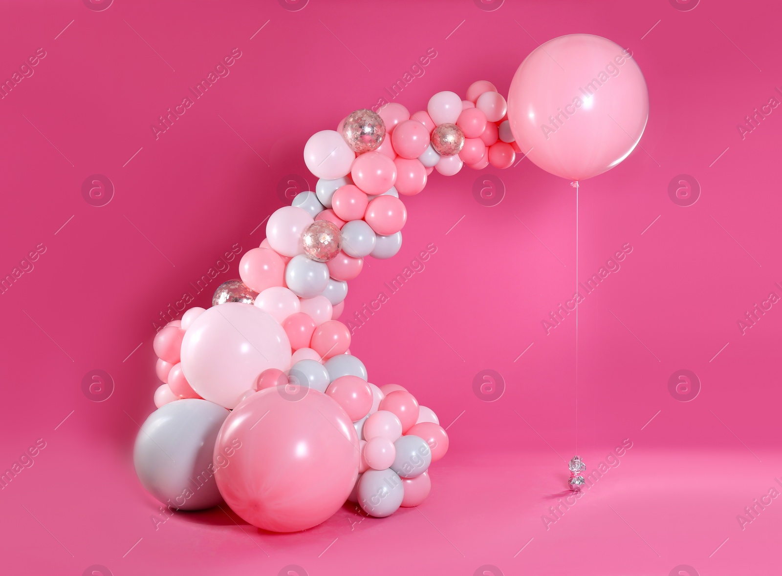 Photo of Beautiful composition with balloons on pink background