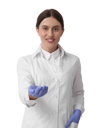 Doctor in coat holding something on white background