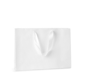 Photo of Paper shopping bag isolated on white. Mock up for design