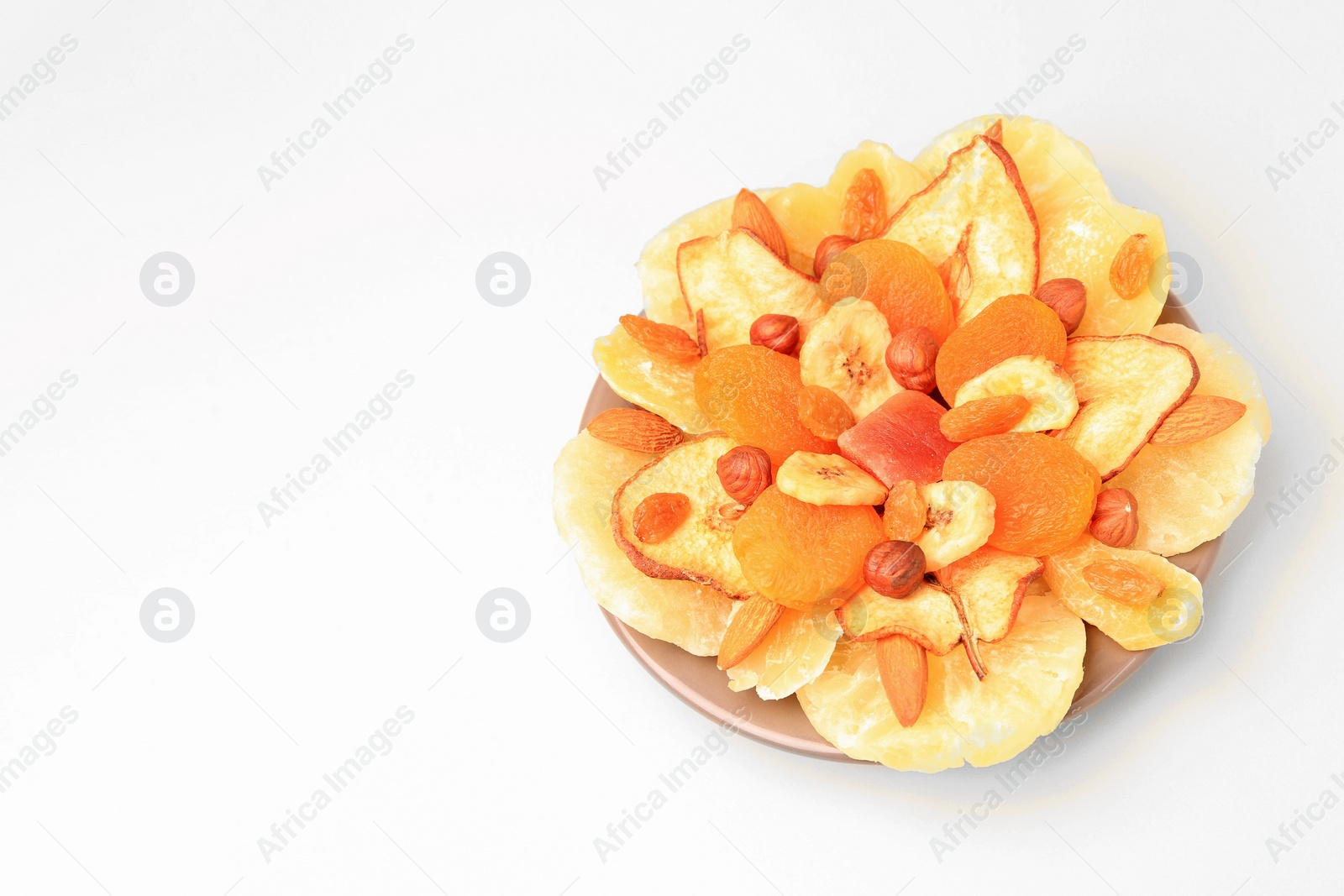 Photo of Mixed dried fruits and nuts on white background, space for text