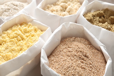 Photo of Different types of flour in paper bags