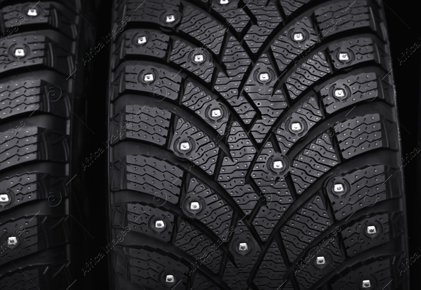 Photo of Car tires as background, closeup. Auto store