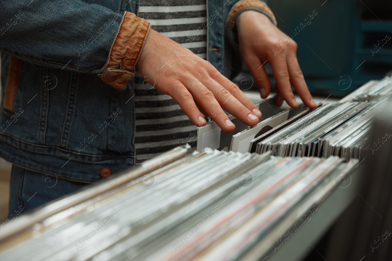 Image of Man choosing vinyl records in store, closeup