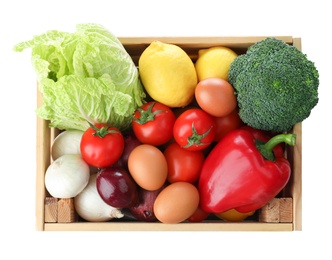 Wooden crate full of fresh products on white background, top view