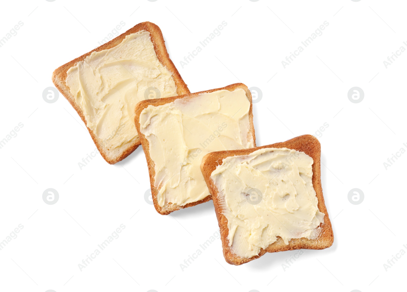 Photo of Tasty toasts with butter on white background, top view