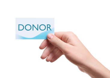 Image of Woman holding card with word DONOR on white background, closeup