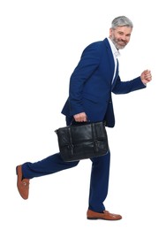Photo of Mature businessman with briefcase walking on white background