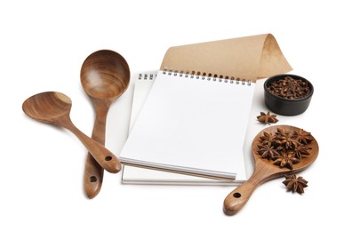 Blank recipe book, spices and wooden utensils on white background. Space for text