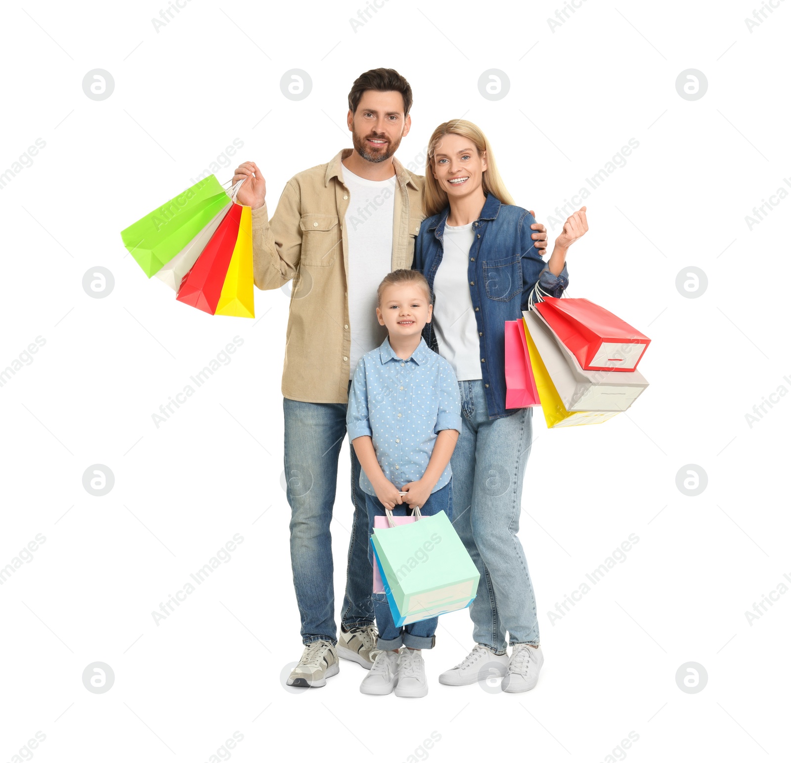 Photo of Family shopping. Happy parents and daughter with many colorful bags on white background