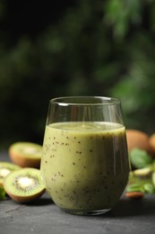 Delicious kiwi smoothie and fresh fruits on grey table