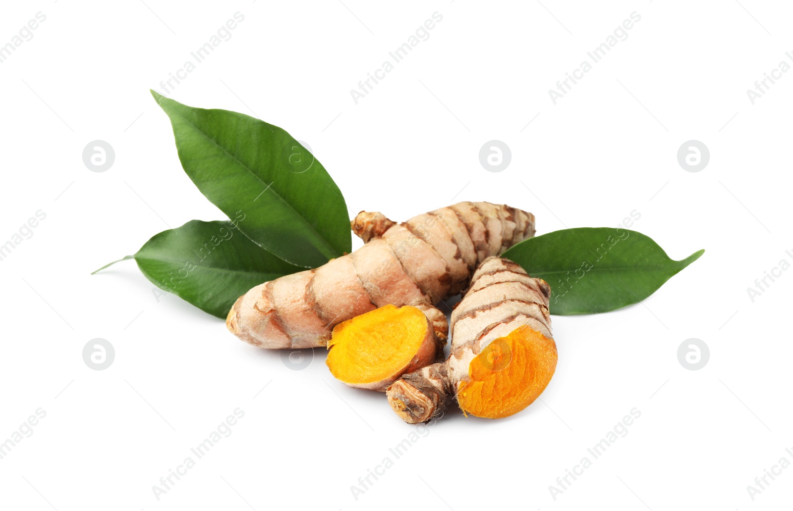 Photo of Fresh turmeric roots and green leaves isolated on white