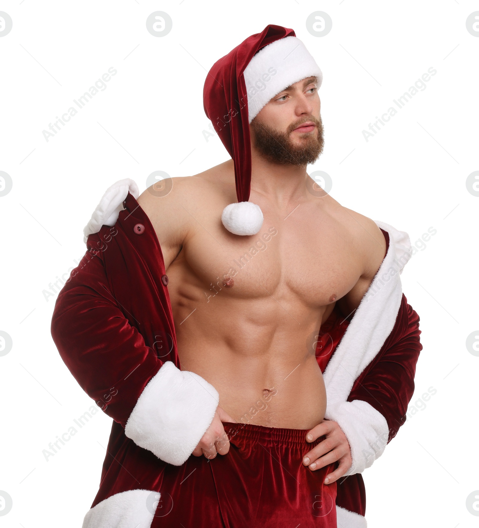 Photo of Attractive young man with muscular body in Santa costume on white background