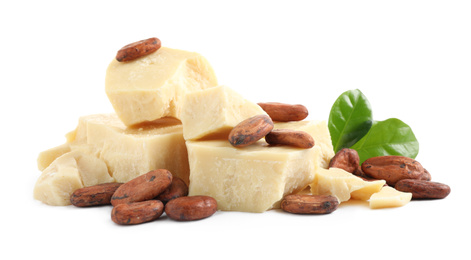 Photo of Organic cocoa butter, beans and green leaves isolated on white