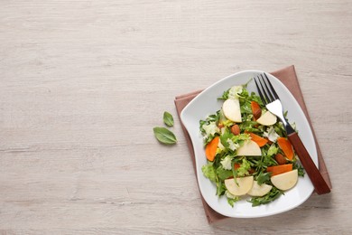 Photo of Delicious turnip salad served on wooden table, flat lay. Space for text