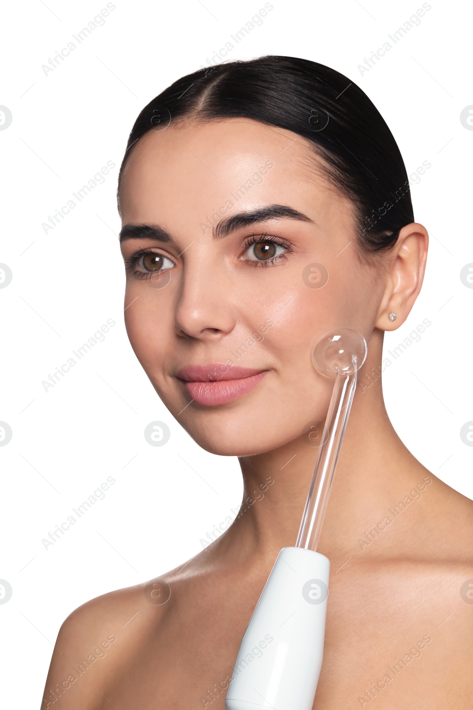 Photo of Woman using high frequency darsonval device on white background