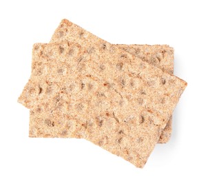 Fresh crunchy crispbreads on white background, top view