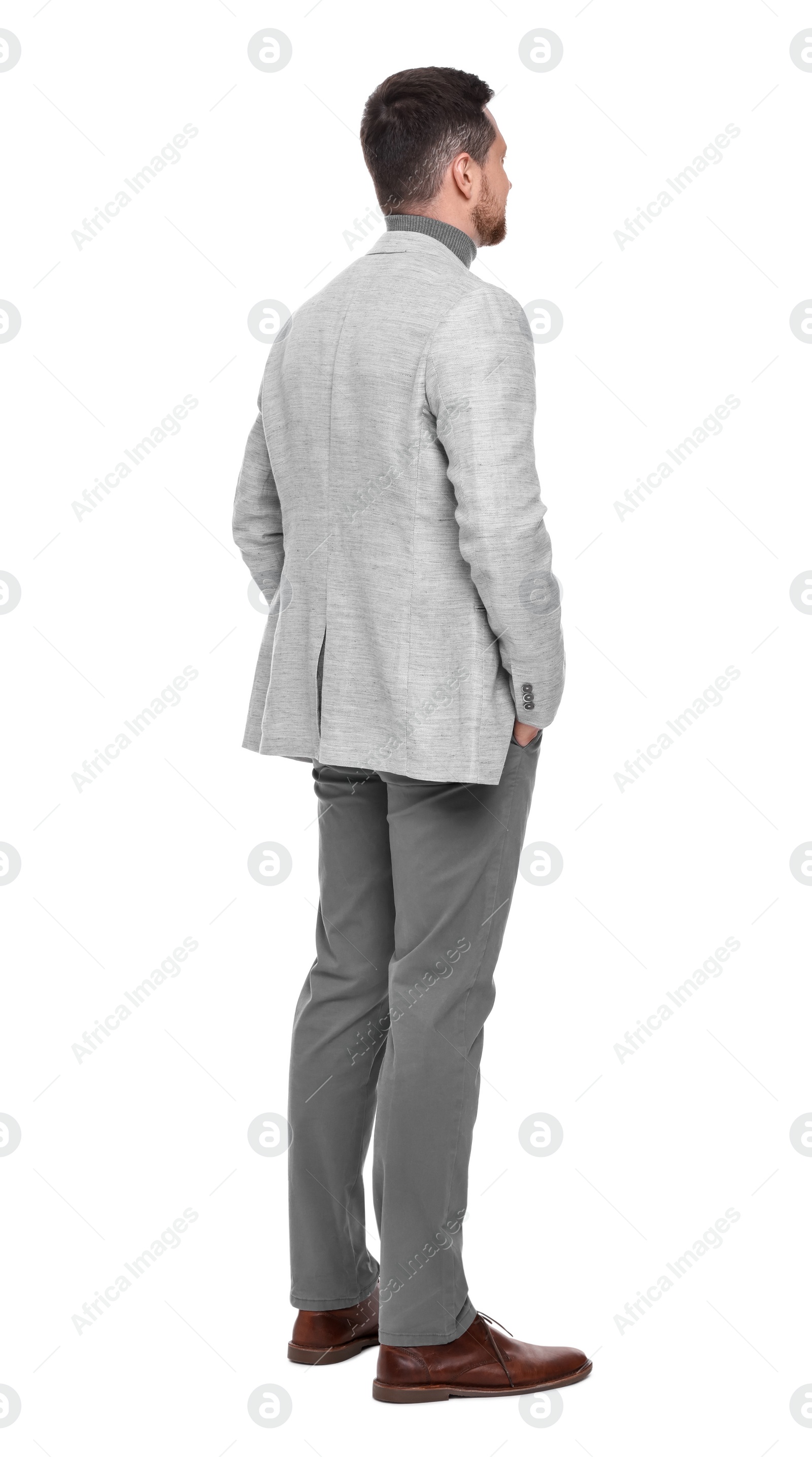 Photo of Businessman in suit standing on white background