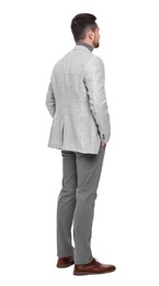 Businessman in suit standing on white background