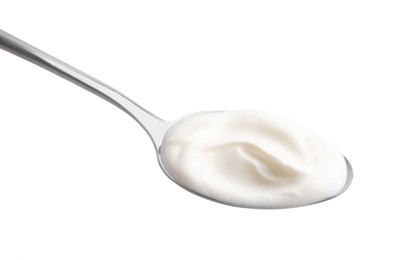 Photo of Spoon with delicious sour cream isolated on white