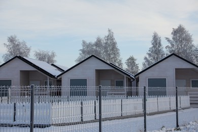 Beautiful landscape with houses and trees in winter morning