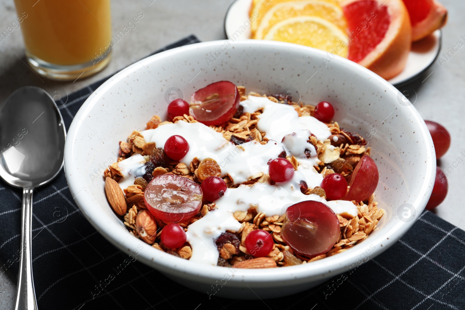 Photo of Tasty healthy breakfast served on grey table