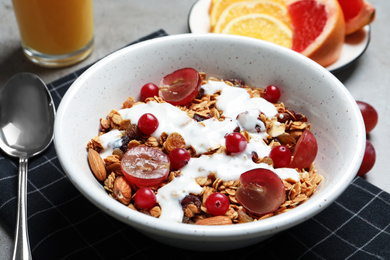 Photo of Tasty healthy breakfast served on grey table