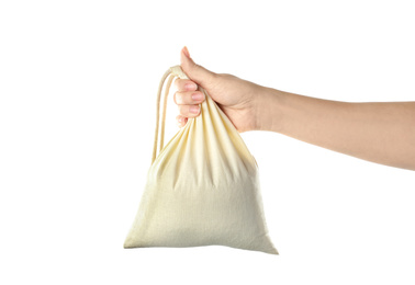 Photo of Woman holding full cotton eco bag on white background, closeup