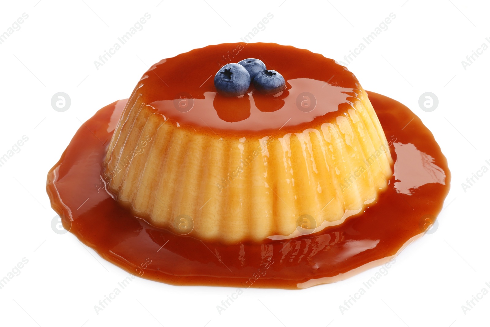 Photo of Delicious pudding with caramel and blueberries isolated on white