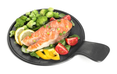 Photo of Healthy meal. Grilled salmon steak, green onion, lemon and vegetables isolated on white
