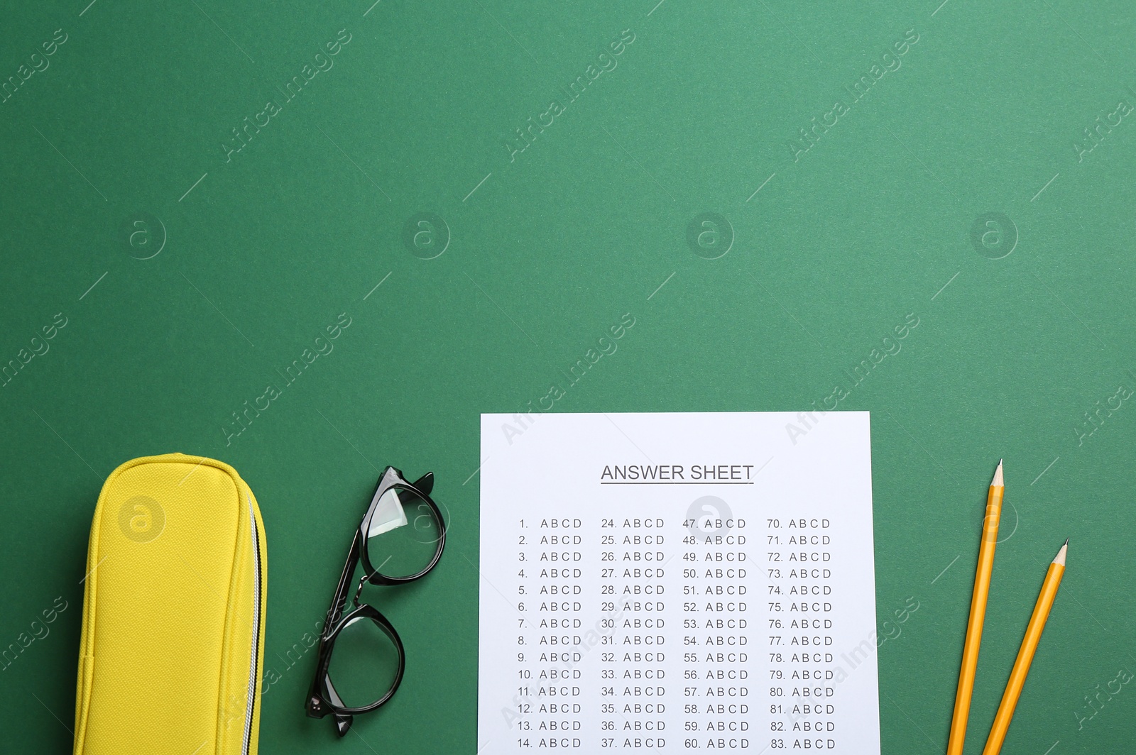 Photo of Flat lay composition with answer sheet and space for text on color background