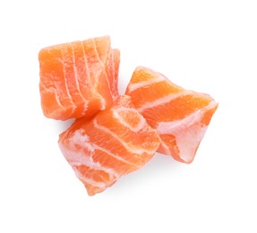 Photo of Pieces of fresh raw salmon on white background, top view