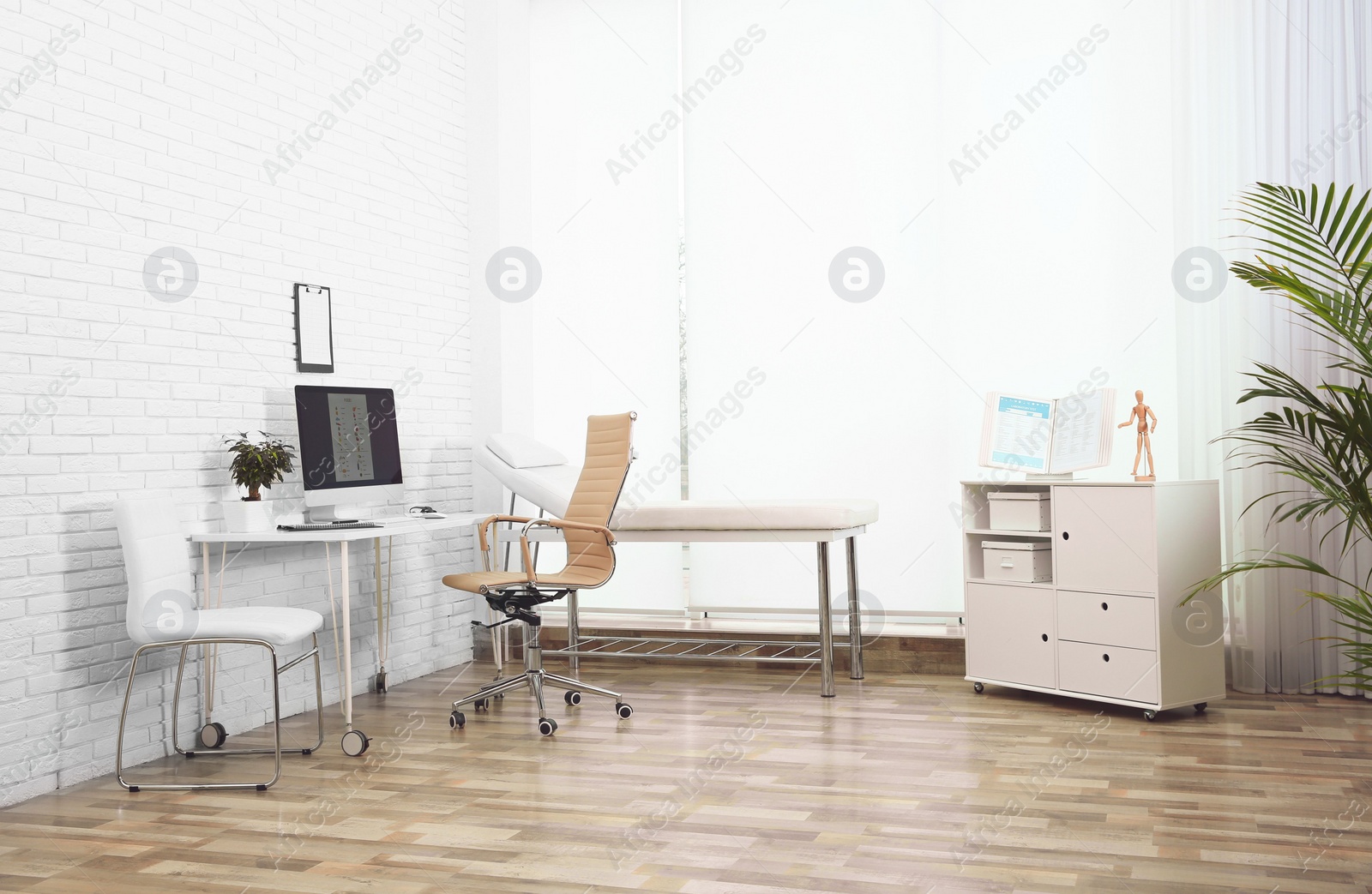 Photo of Interior of modern medical office. Doctor's workplace